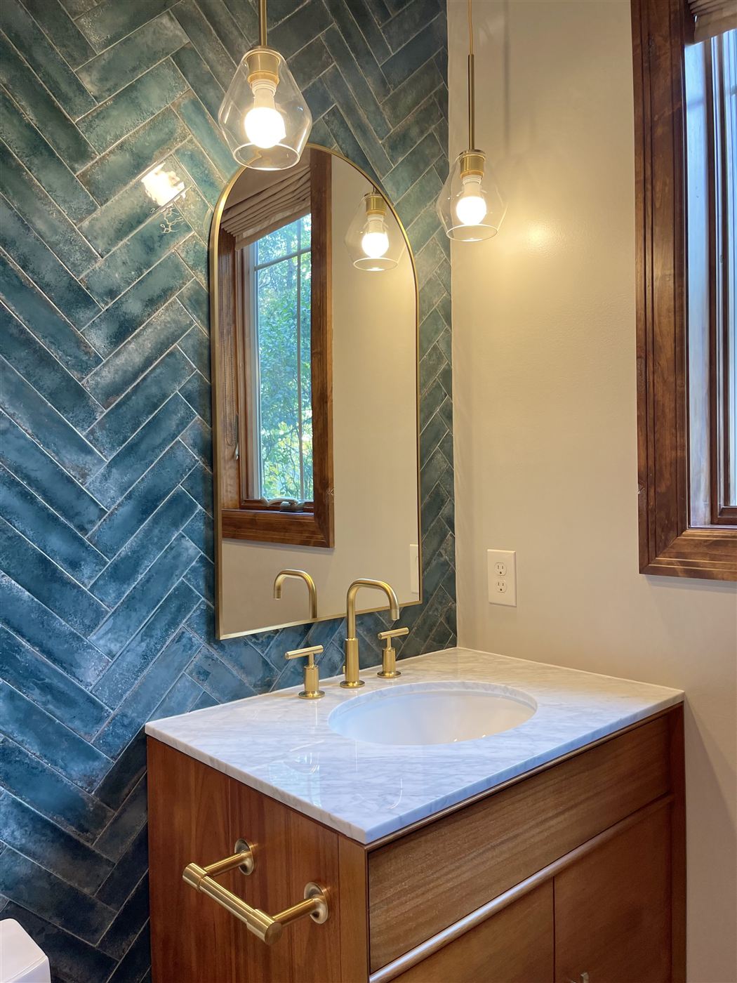 Vanity with green tile accent